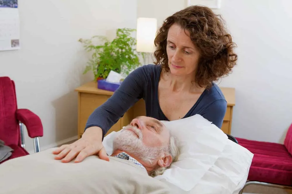 Osteopath using gentle hands-on techniques with a patient at The Courtyard Osteopaths, Bedminster, Bristol